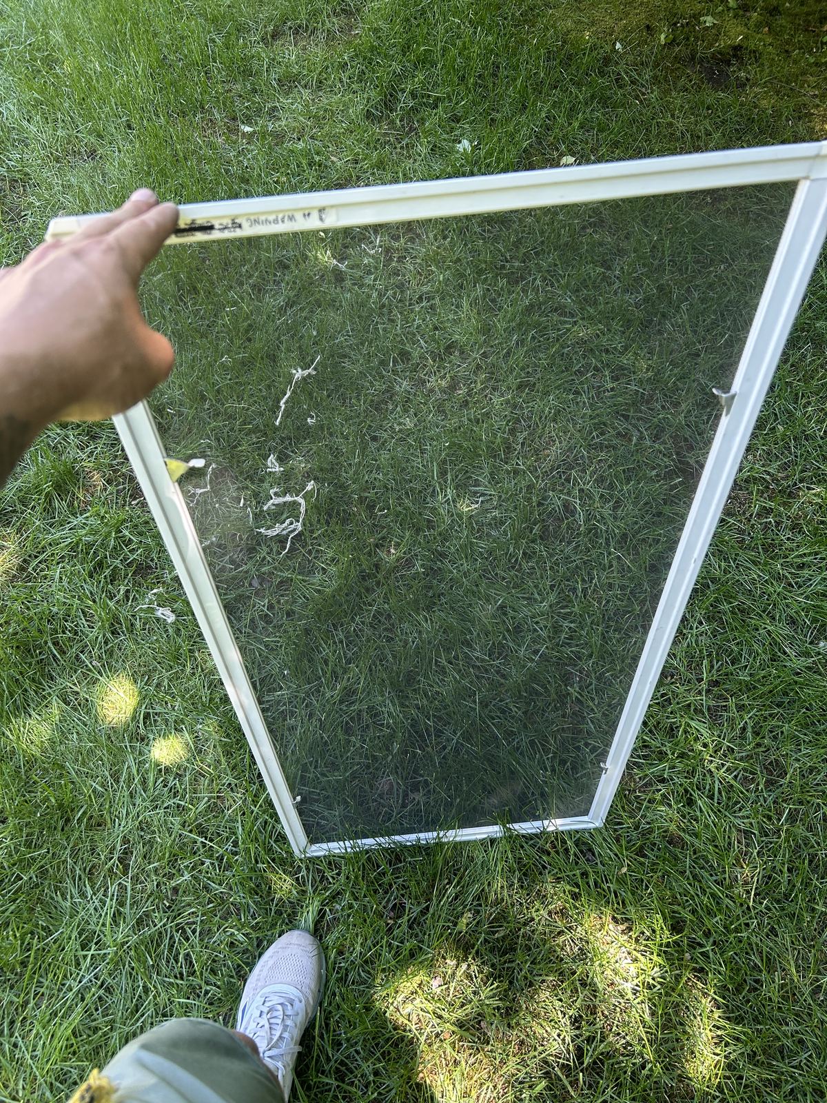 A window screen after cleaning, clear and free of dust
